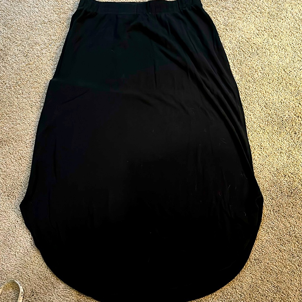 Lane Bryant black cotton stretchy skirt. Curved along the bottom size 14/16. 36”